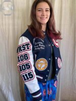 Close-up of a high-density 3D puff embroidery mascot patch on the chest of a New Jersey custom baseball varsity jacket.