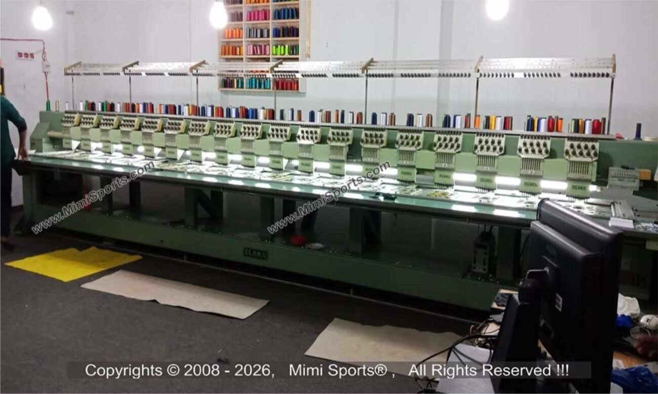 High-density custom embroidery on a performance polo shirt showing 3D puff stitching and fine detail by MimiSports USA.