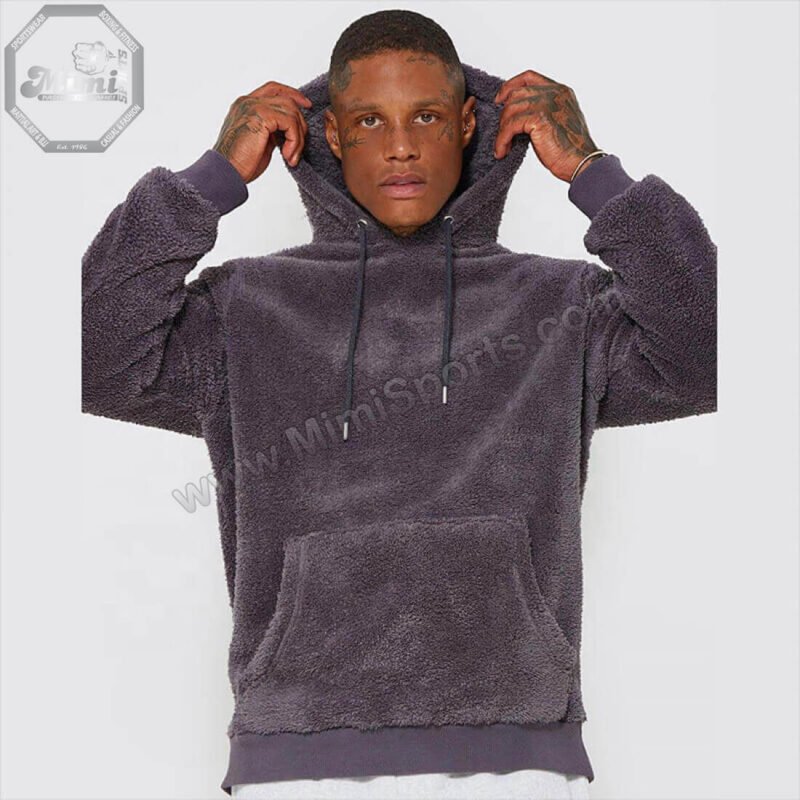 Technical view of MimiSports USA dark grey hoodie showing a high-stitch embroidery logo for a premium 3D finish.