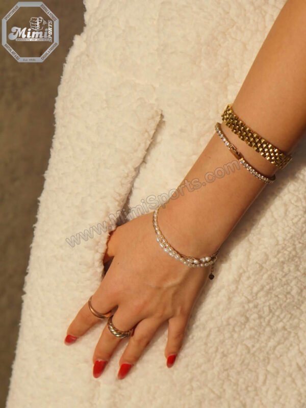 Technical view of MimiSports USA sherpa hoodie showing a high-stitch-count embroidery logo for a premium 3D finish.